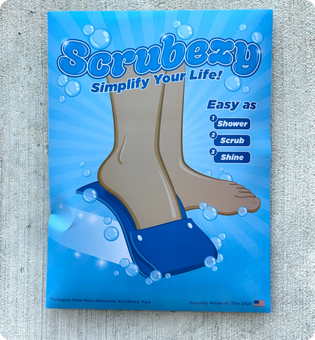 Foot scrubber product advertisement with blue background.